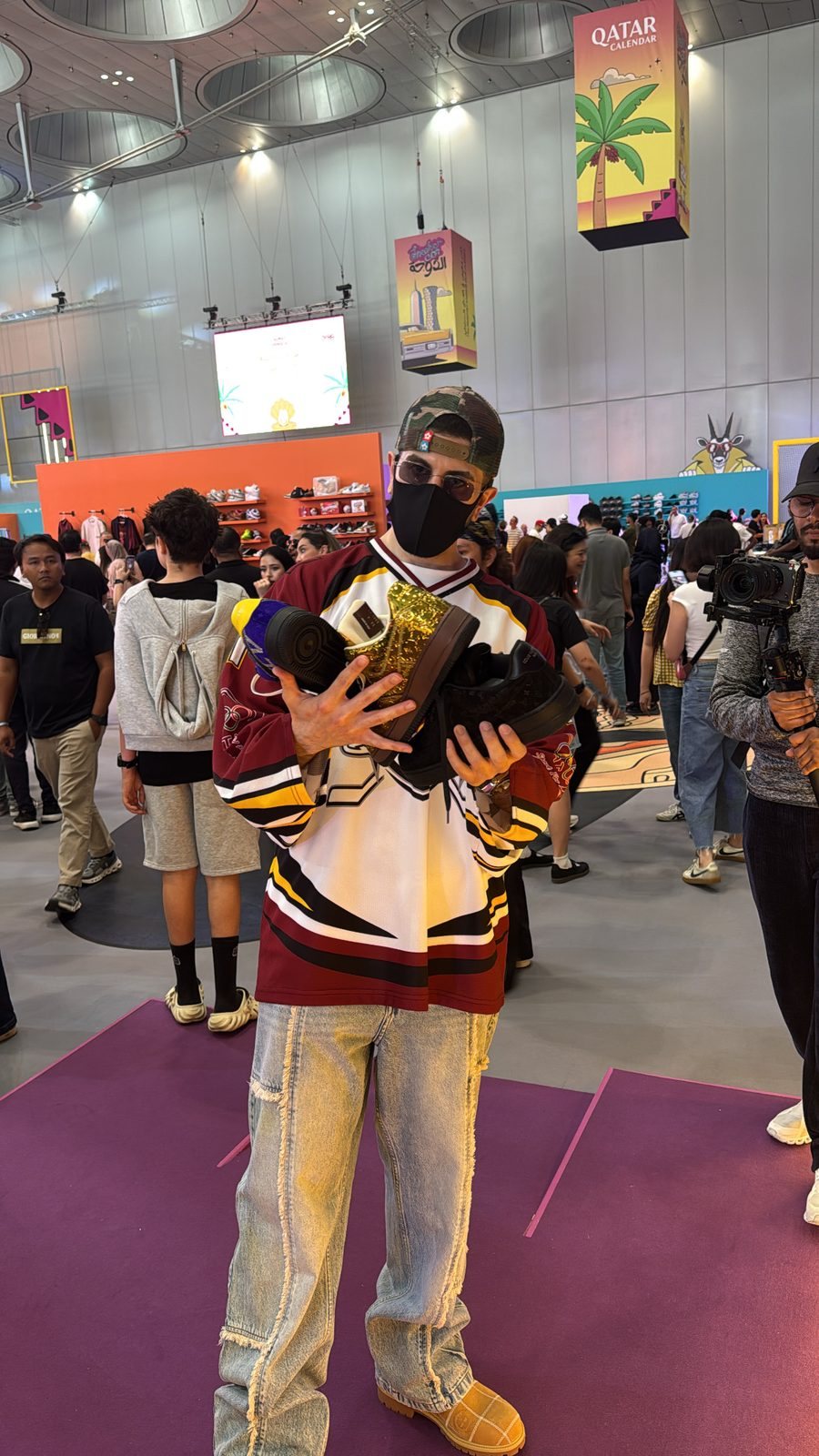 Kevin Aoun carrying a haul of rare sneakers at Sneaker Con Doha